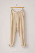 Runway Tie-Cuff Tapered Trousers – Small, sand beige with V-waist and self-tie bow cuffs