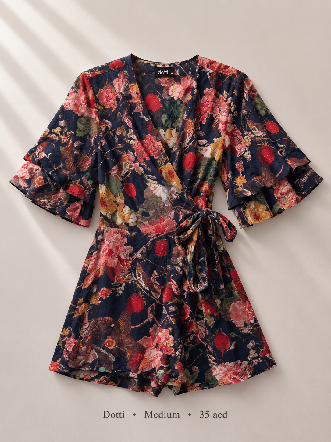 Dotti navy botanical floral wrap romper with tiered ruffle flutter sleeves, size Medium