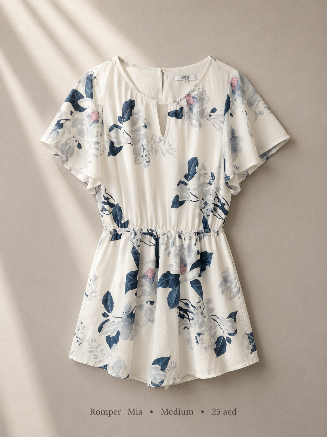 Mia ivory watercolour floral flutter-sleeve romper with V-neck and elasticated waist, size Medium