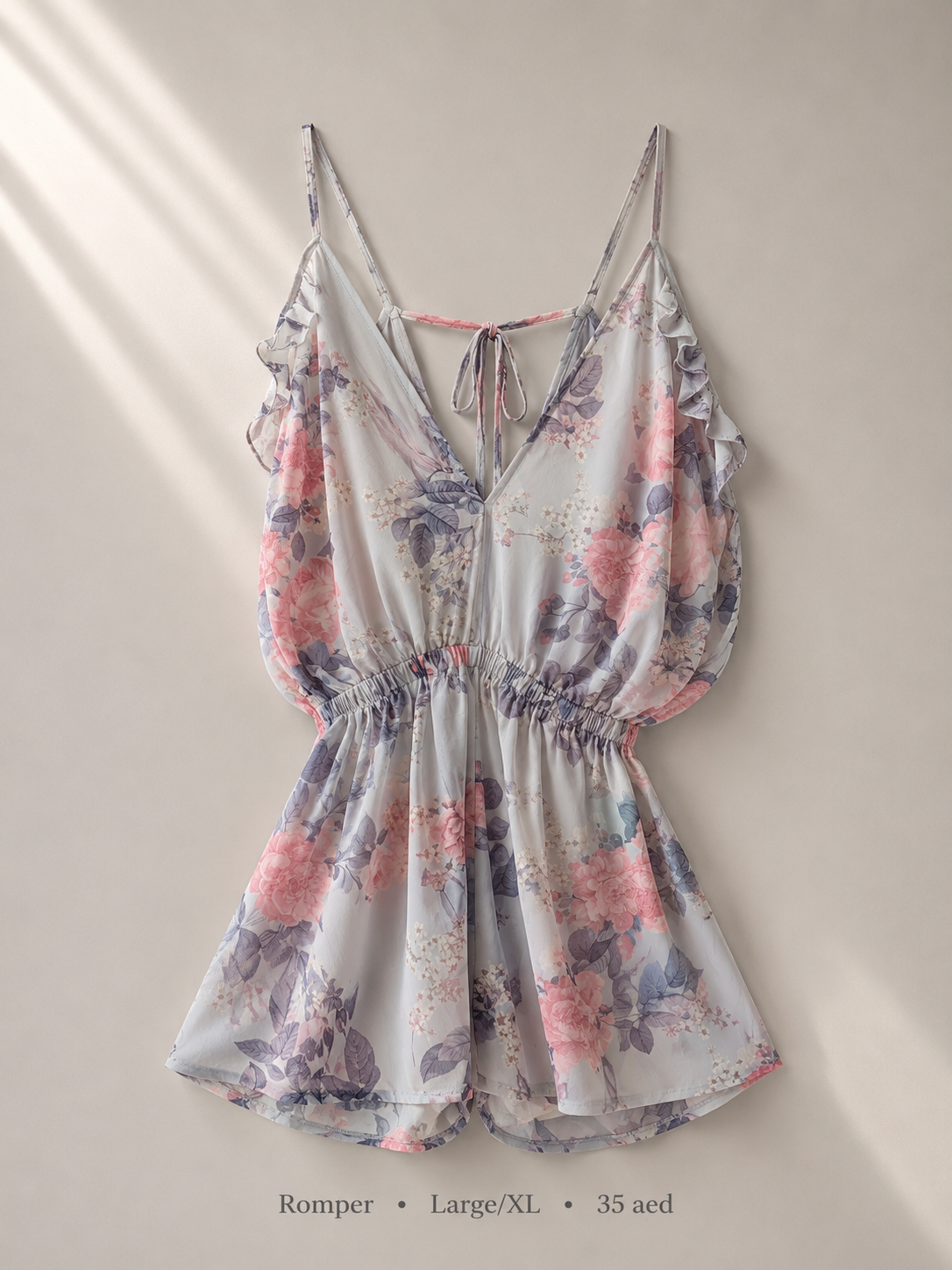 Floral ruffle romper in pink, blue and lavender tones, size Large/XL