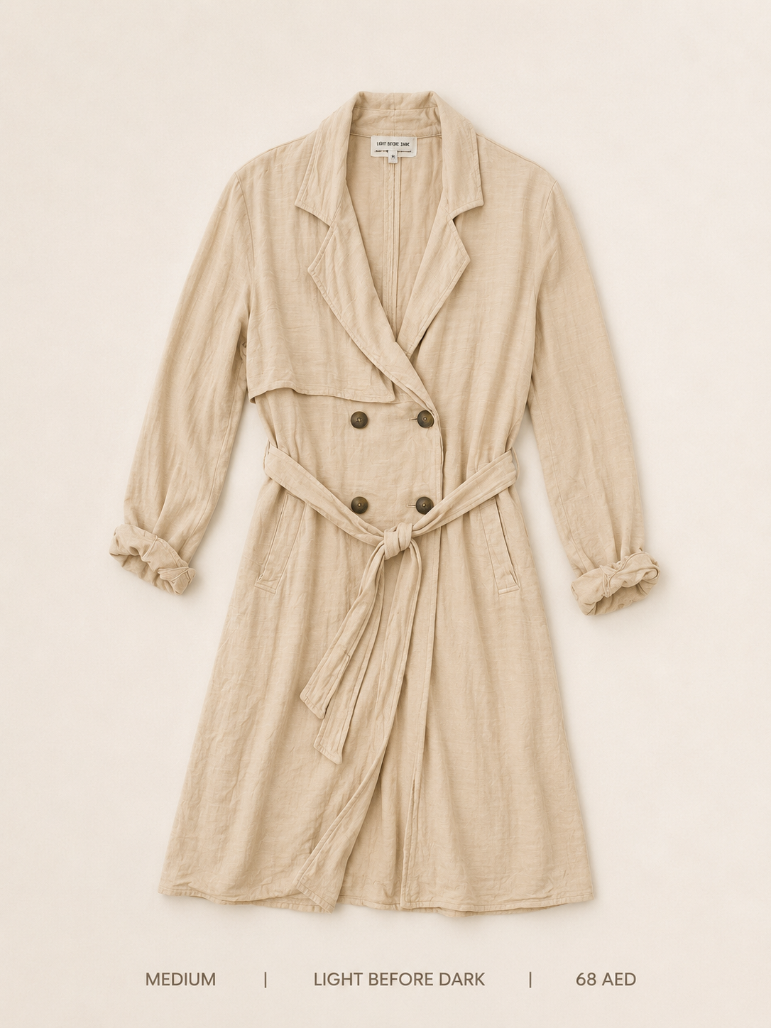Light Before Dark Double-Breasted Belted Trench Coat – Medium, soft sand with draped lapel and self-tie belt