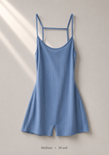 Ribbed powder blue cami romper with crossover open-back straps, size Medium — front view