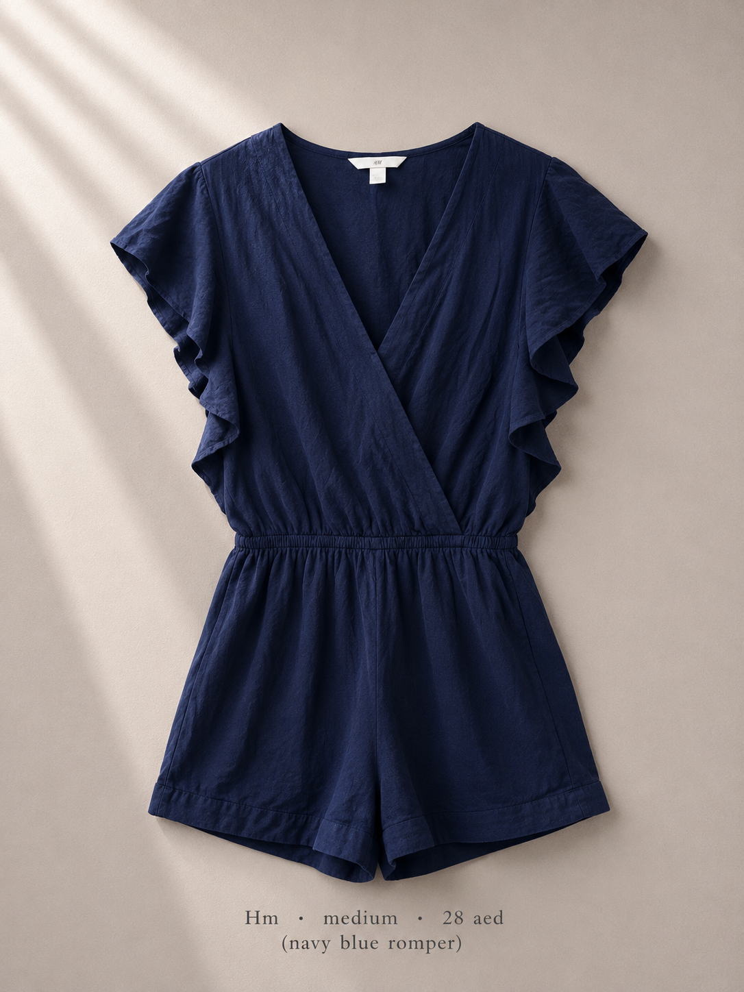 H&M deep navy wrap flutter-sleeve romper with crossover V-neck, size Medium