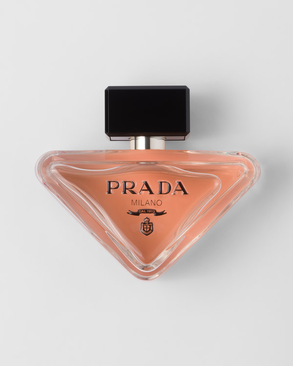 Prada Milano perfume in a pink triangular bottle
