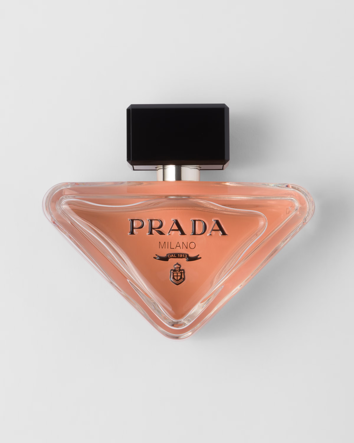 Prada Milano perfume in a pink triangular bottle